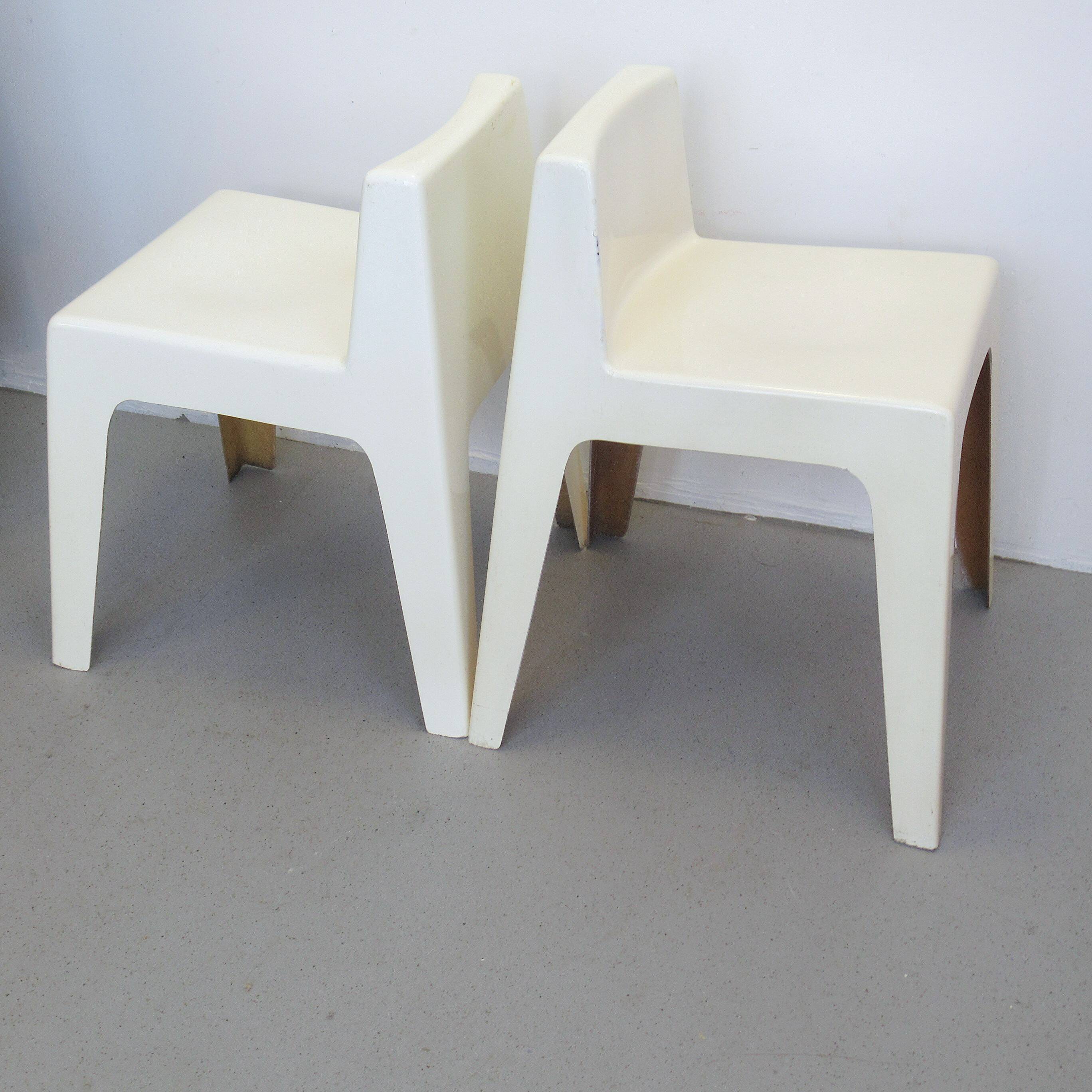 Two white fiberglass Kostka chairs 1970