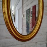 Miroir ovale doré