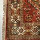 Antique wool rugs with designs on a red background, 20th century.