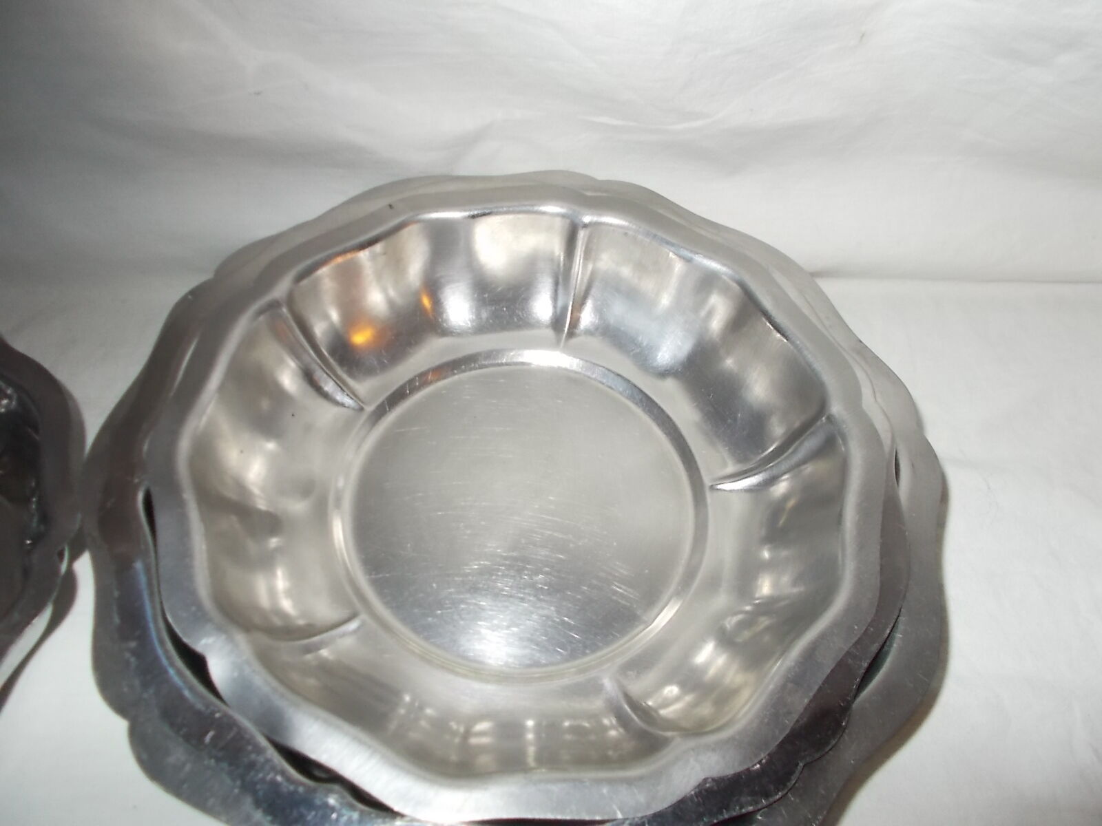 Lot of 4 round hollow stainless steel dishes