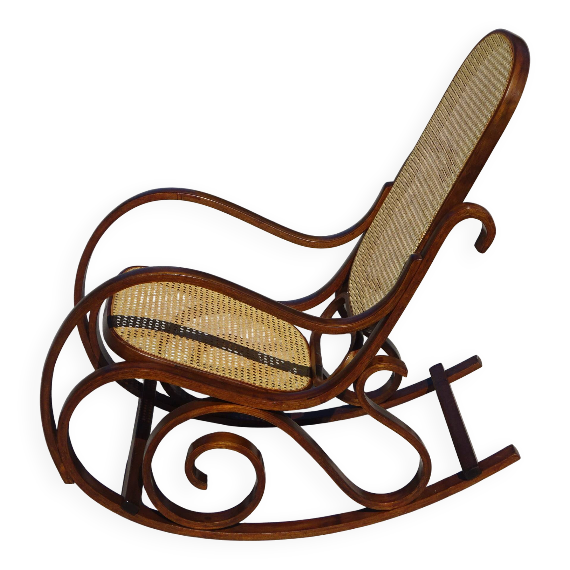 Vintage wooden rocking chair with caning