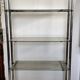 Chromed metal tubular shelf with smoked glass.