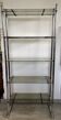 Chromed metal tubular shelf with smoked glass.