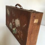 Suitcase of leather with labels of palaces