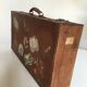 Suitcase of leather with labels of palaces