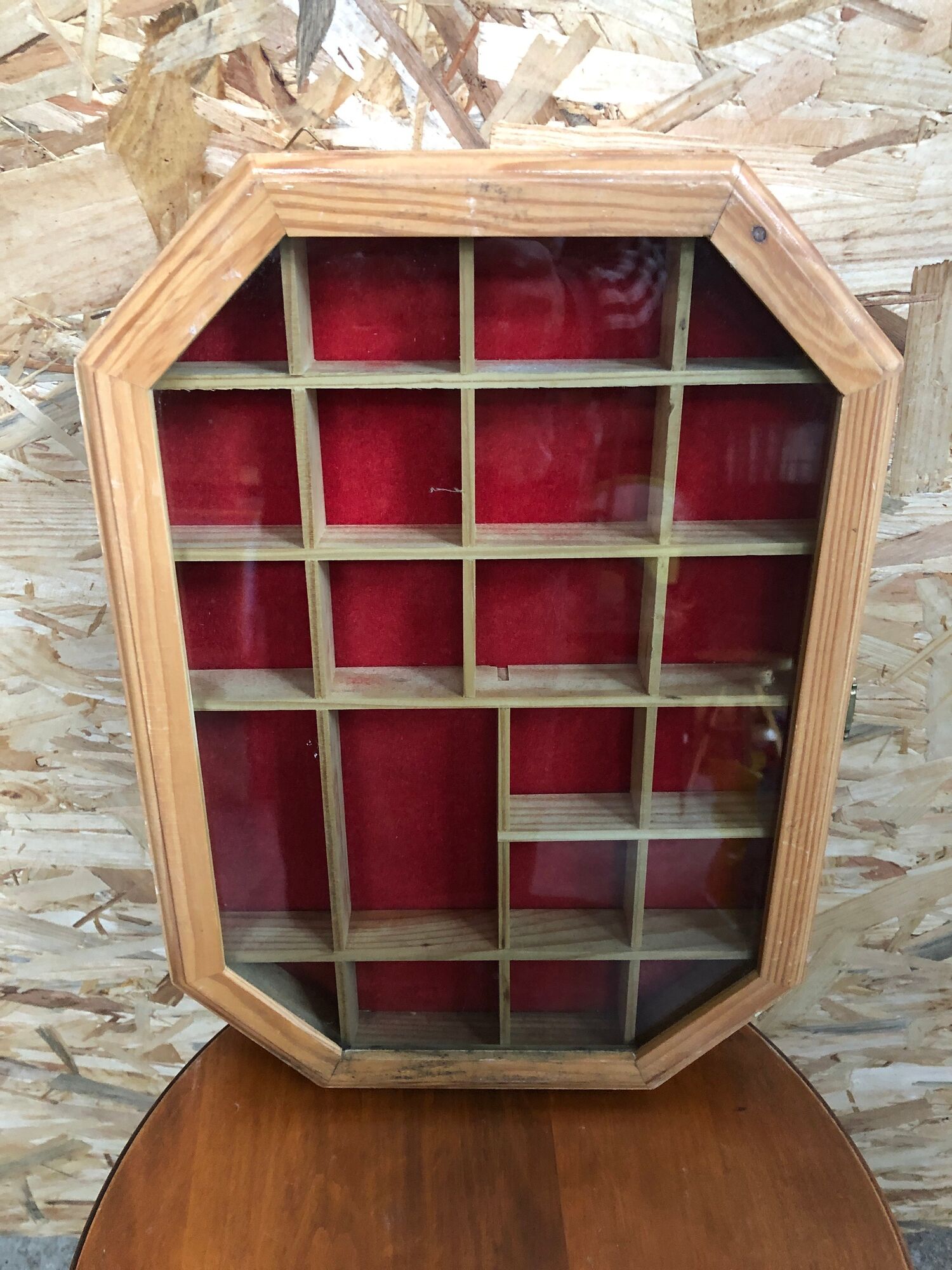 Old hanging showcase 22 wooden boxes red background