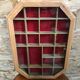 Old hanging showcase 22 wooden boxes red background