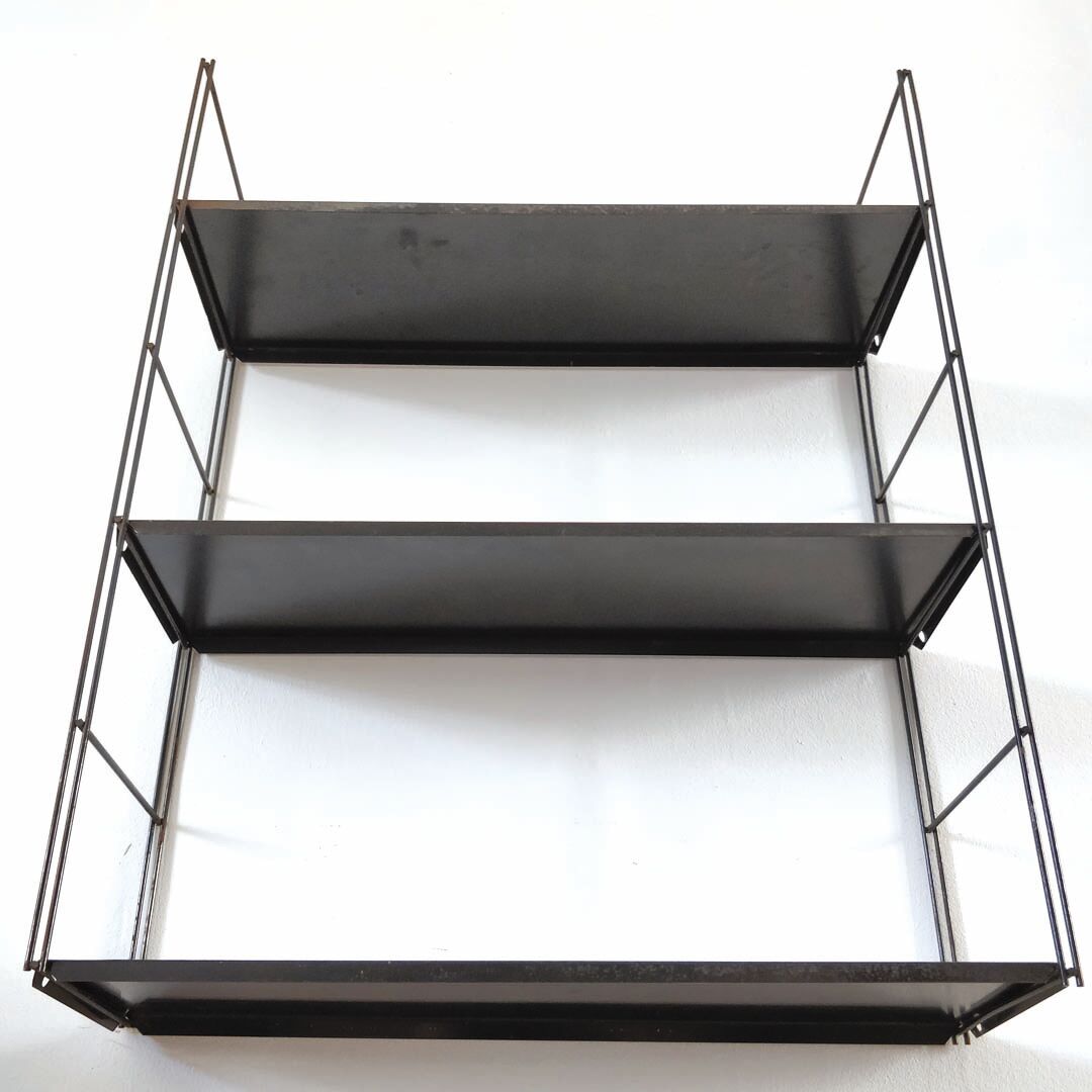 Patinated metal wall shelf
