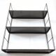 Patinated metal wall shelf