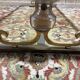 Table basse en métal doré et verre attribuée à la maison BAGUÈS