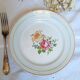 Flat earthenware plates with gilded edges