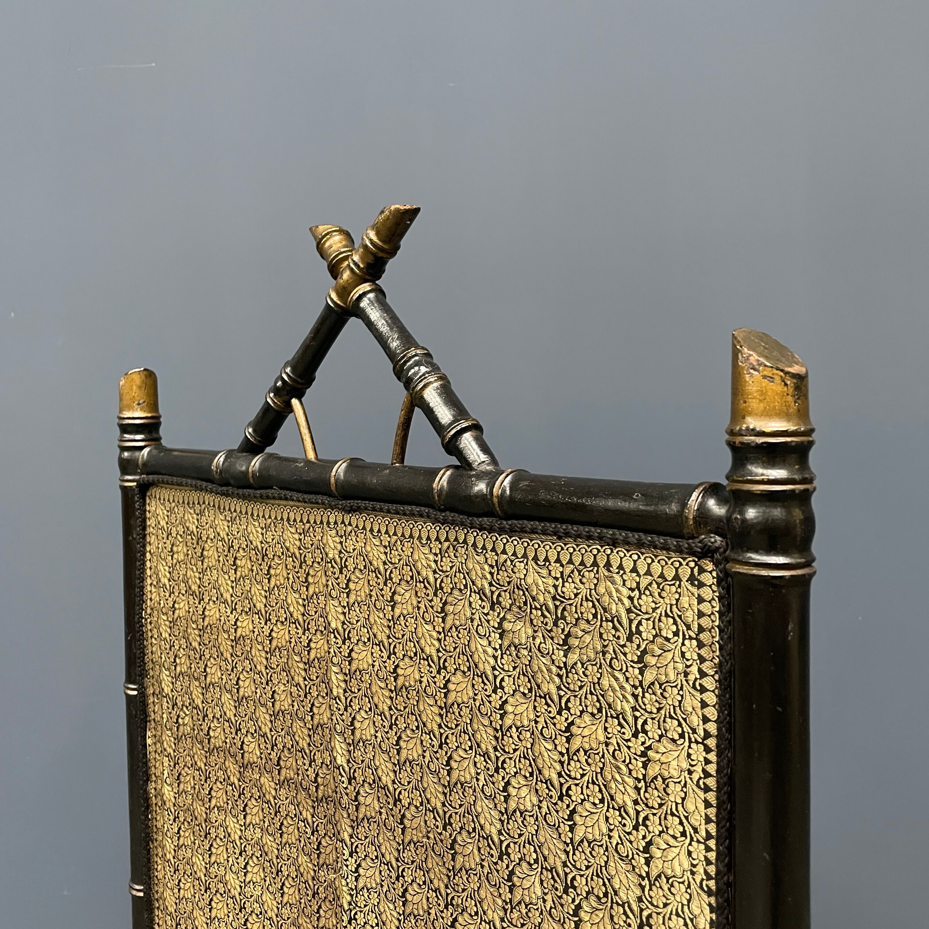 Antique black and gold faux bamboo fireplace screen