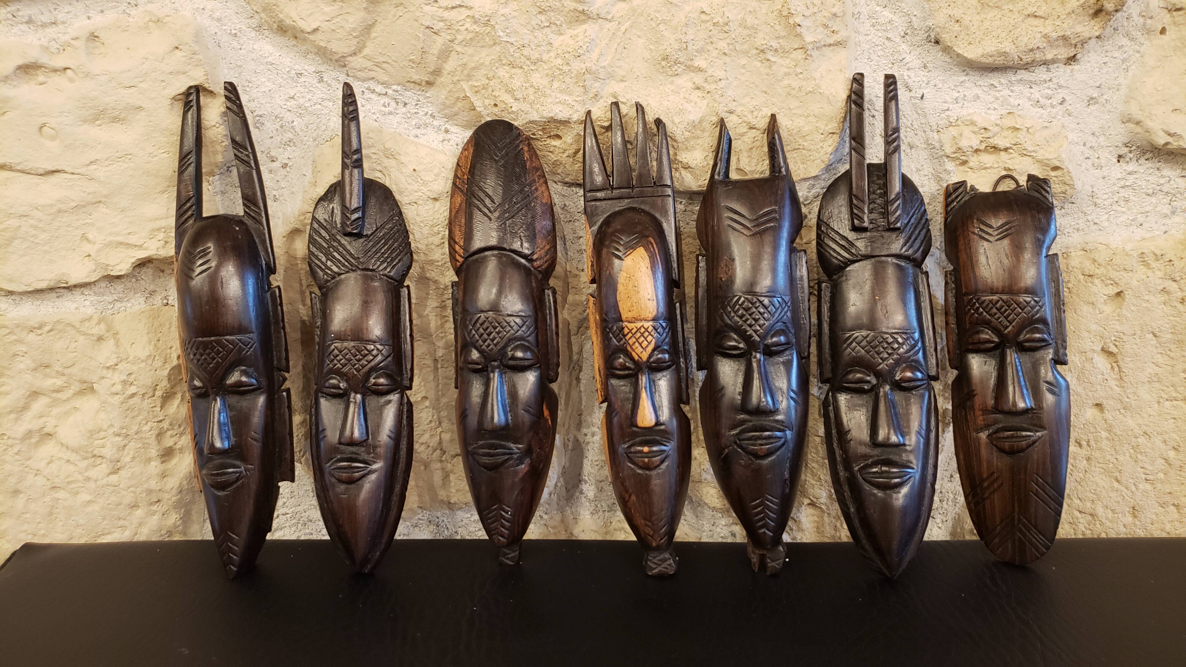 7 weekly African masks in carved wood