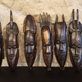 7 weekly African masks in carved wood