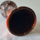 Vase en céramique orange marron avec coulures en relief