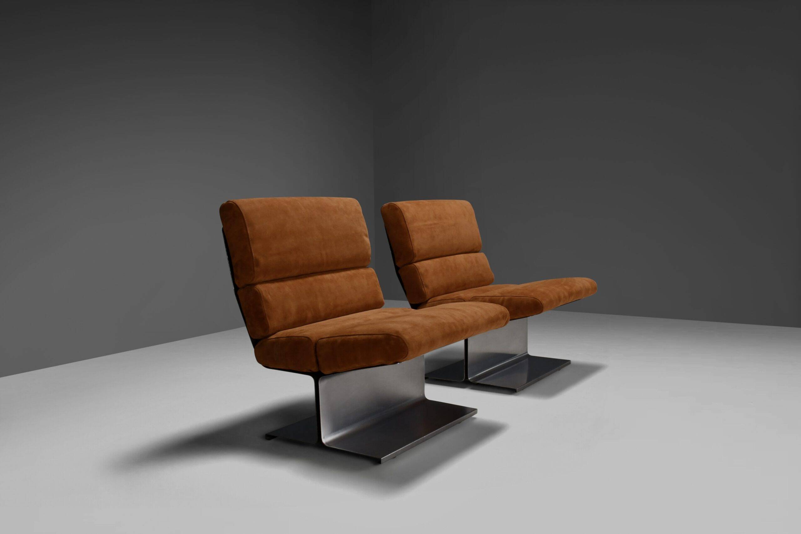 Very rare pair of leather and steel lounge chairs by Paul Geoffroy for Uginox