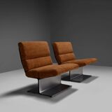 Very rare pair of leather and steel lounge chairs by Paul Geoffroy for Uginox