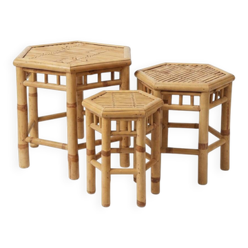 Set of three vintage rattan side tables.