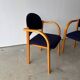 Set of two stackable beech chairs in curved Scandinavian style from IKEA.