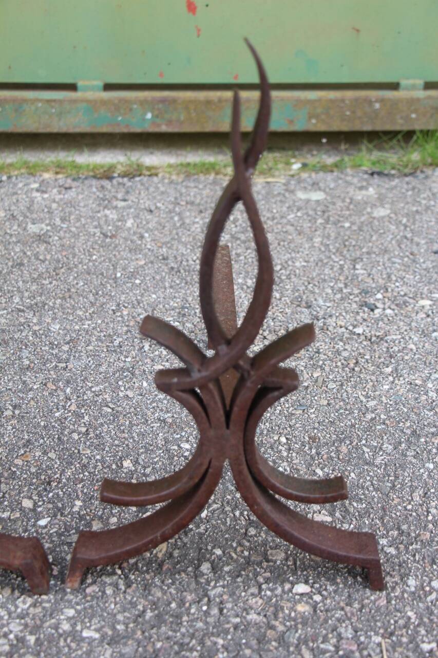 pair of andirons attributed to Raymond Subes, flame model