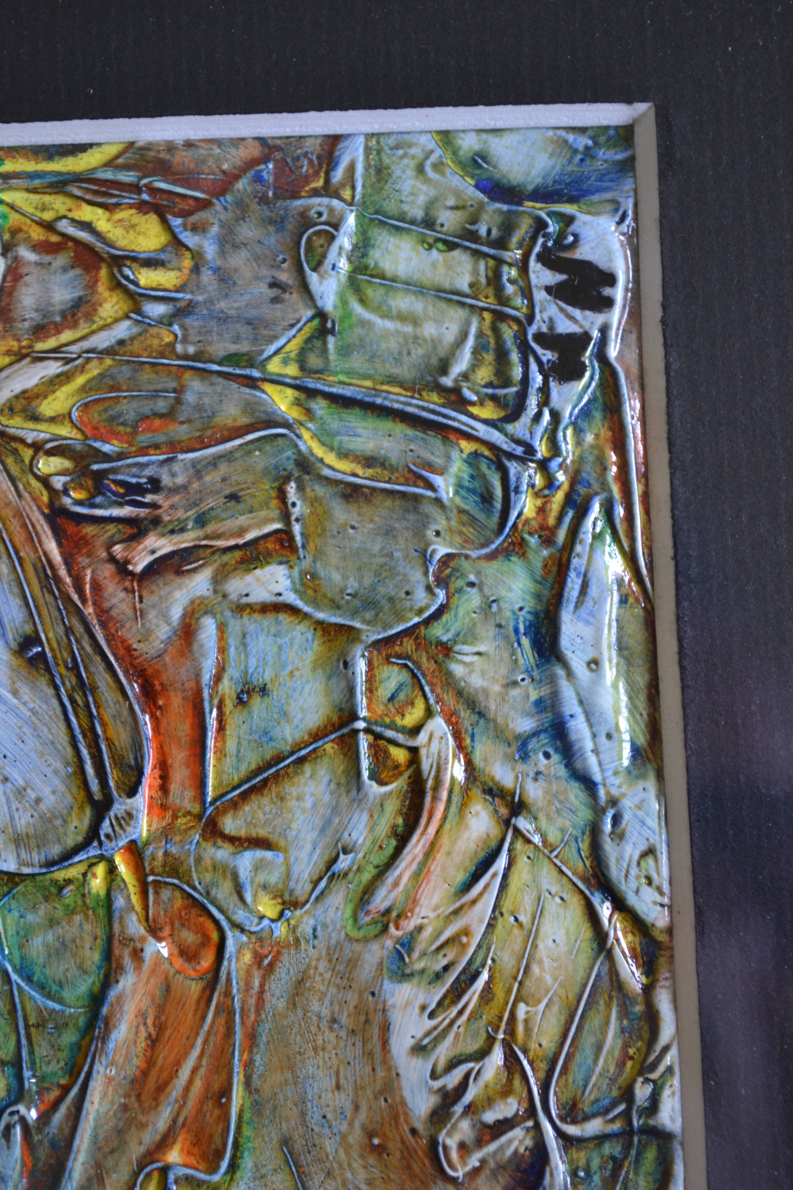 Framed abstract painting under glass