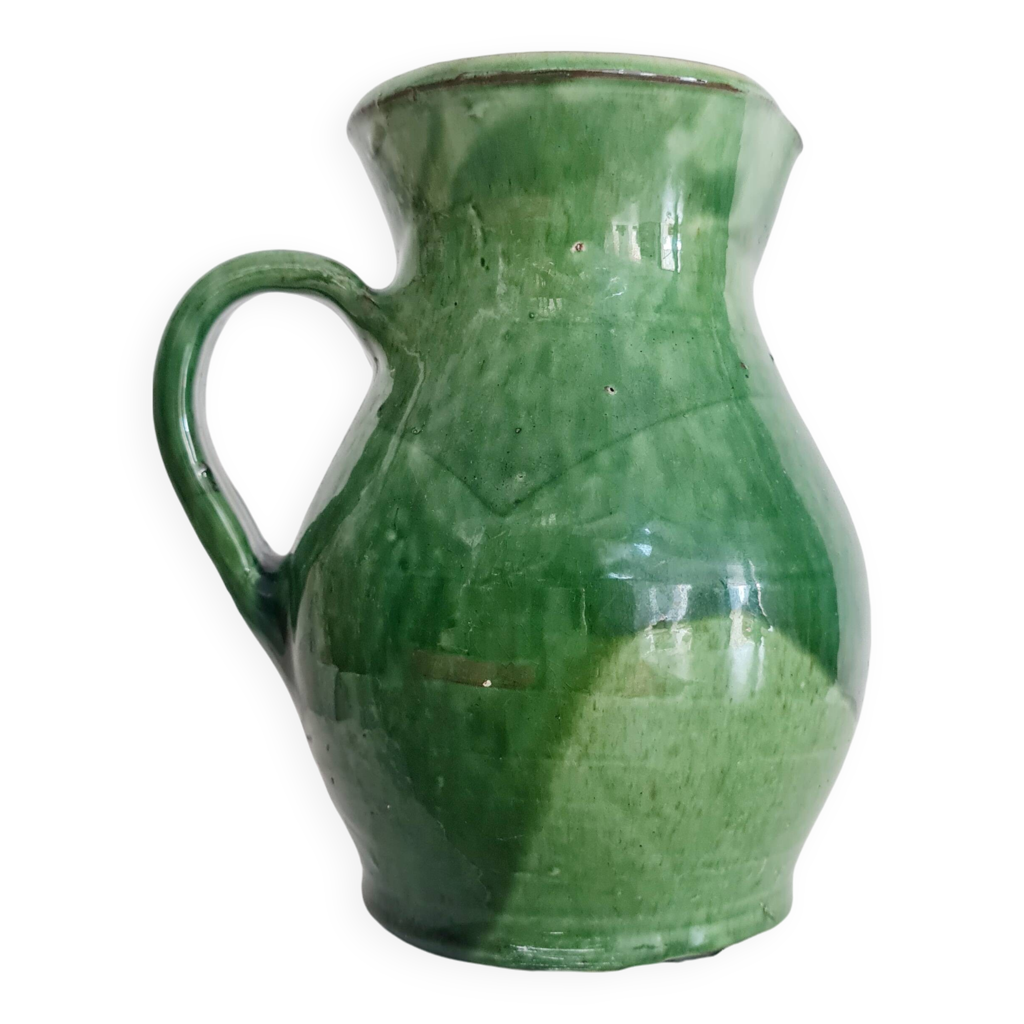 Antique green pitcher in painted terracotta