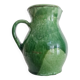 Antique green pitcher in painted terracotta