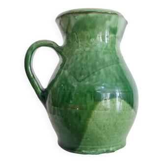 Antique green pitcher in painted terracotta