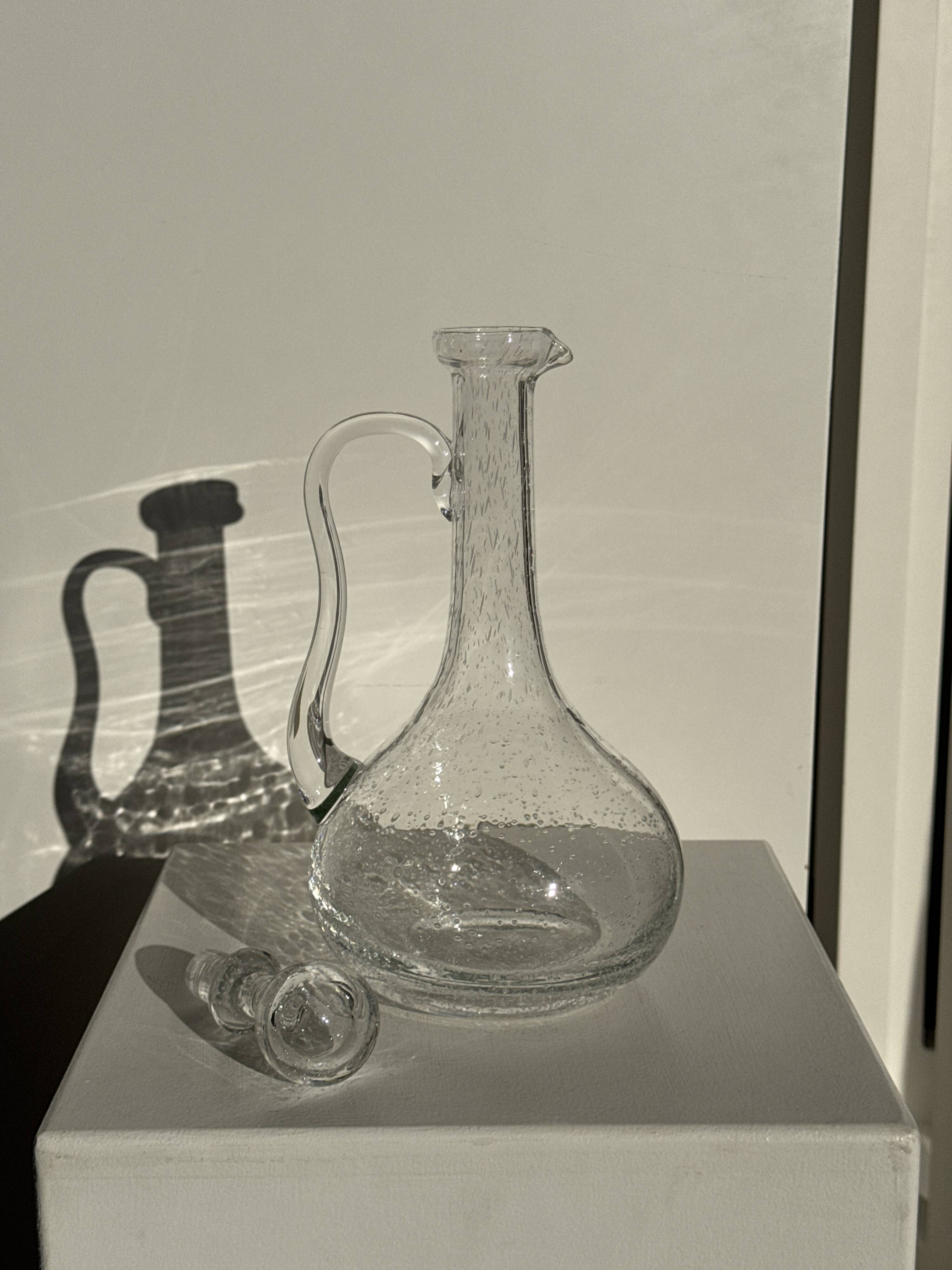 Large transparent glass carafe with a Biot stopper H32 D14.5