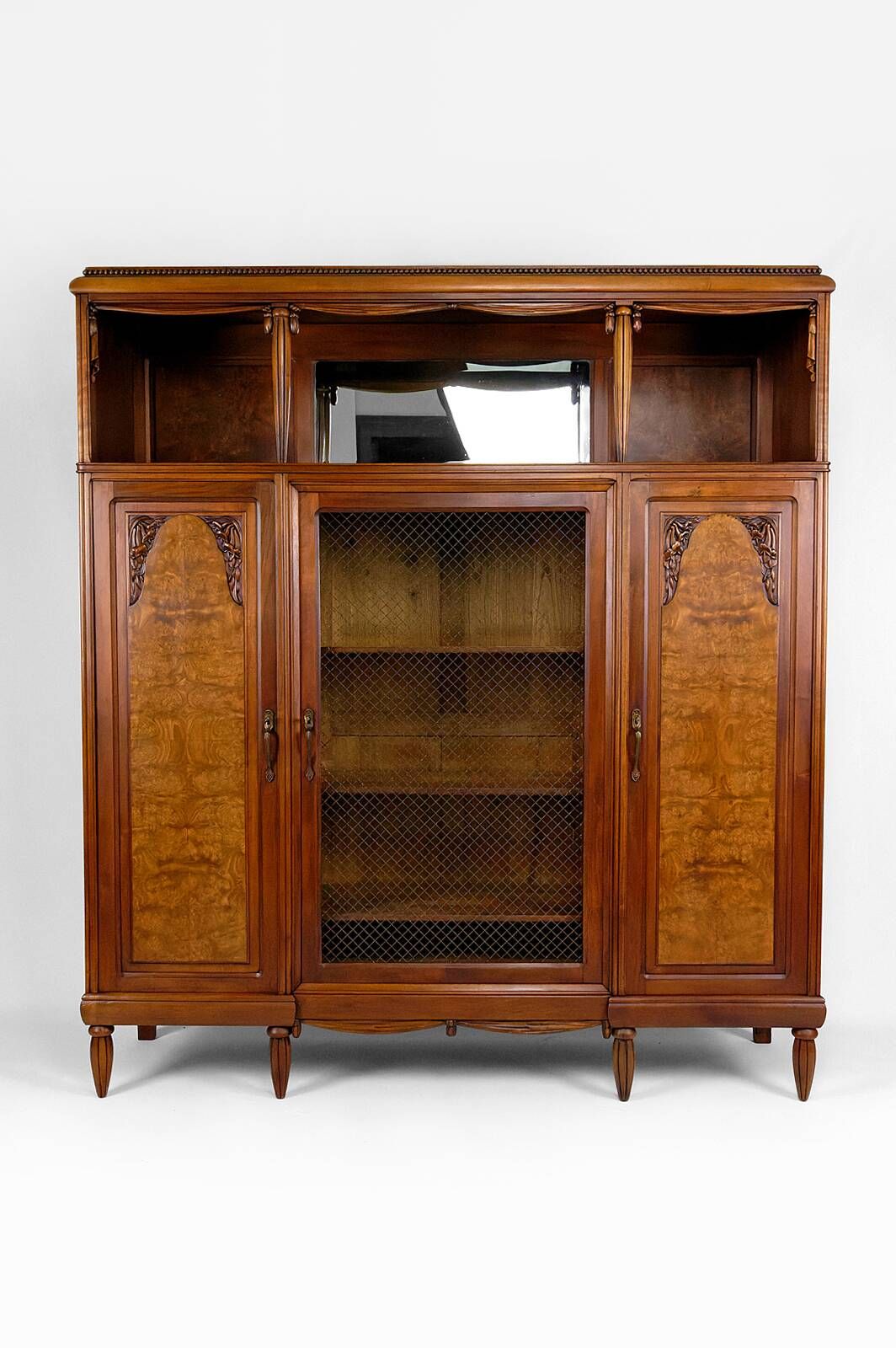 Art Deco showcase bookcase in carved walnut, France, circa 1925