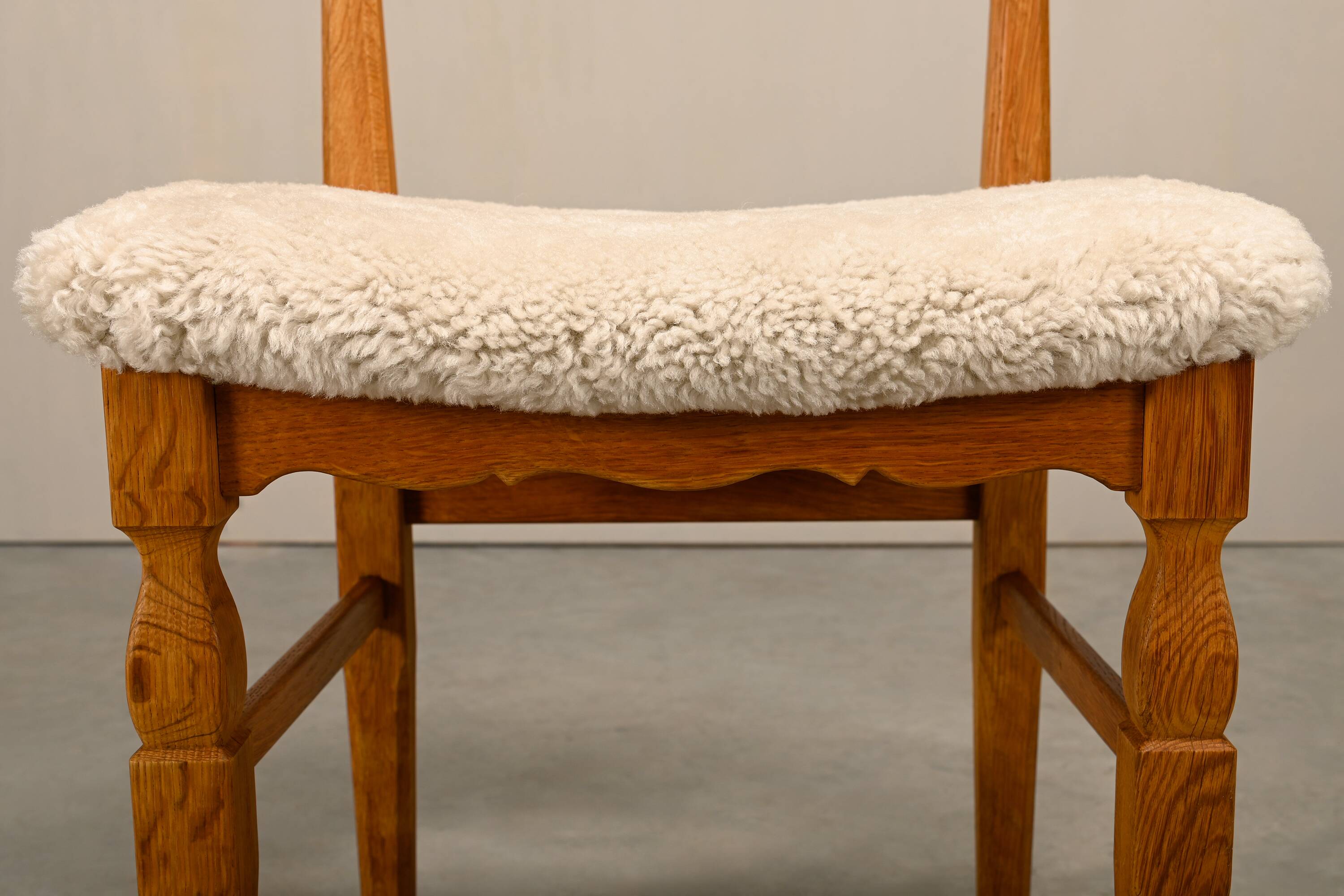 Henning Kjærnulf brutalist dining chairs set in Oak and Sheepskin, Denmark