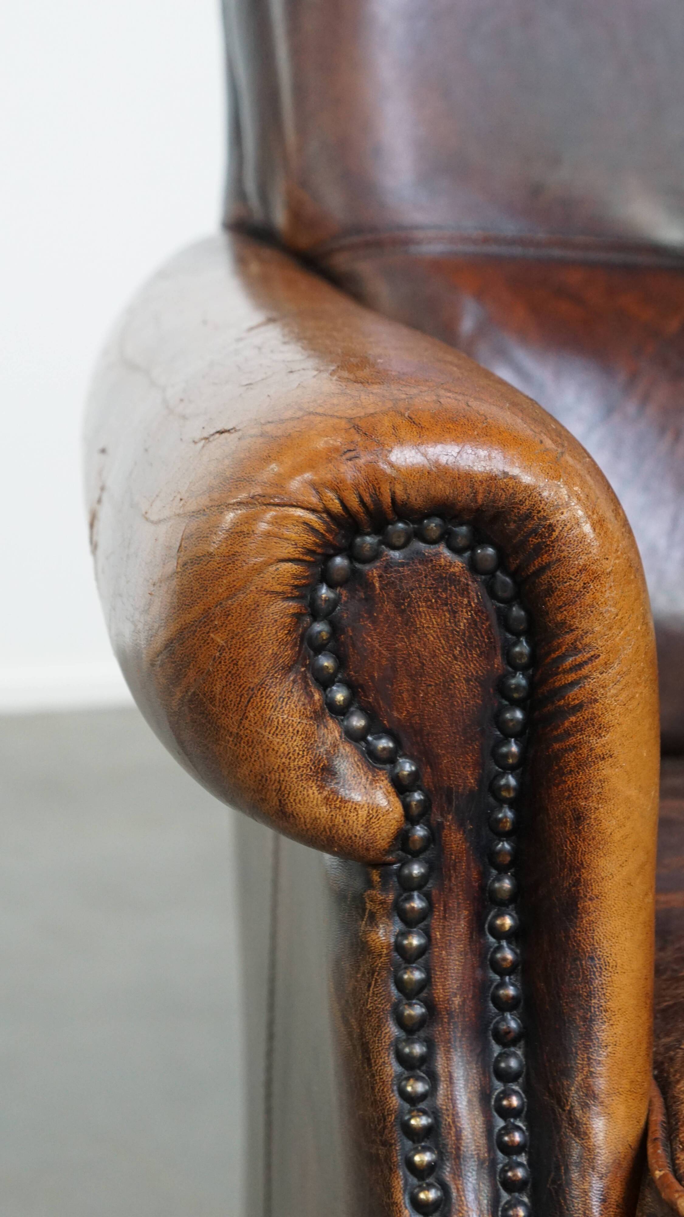 Fauteuil vintage en cuir de mouton avec dossier haut