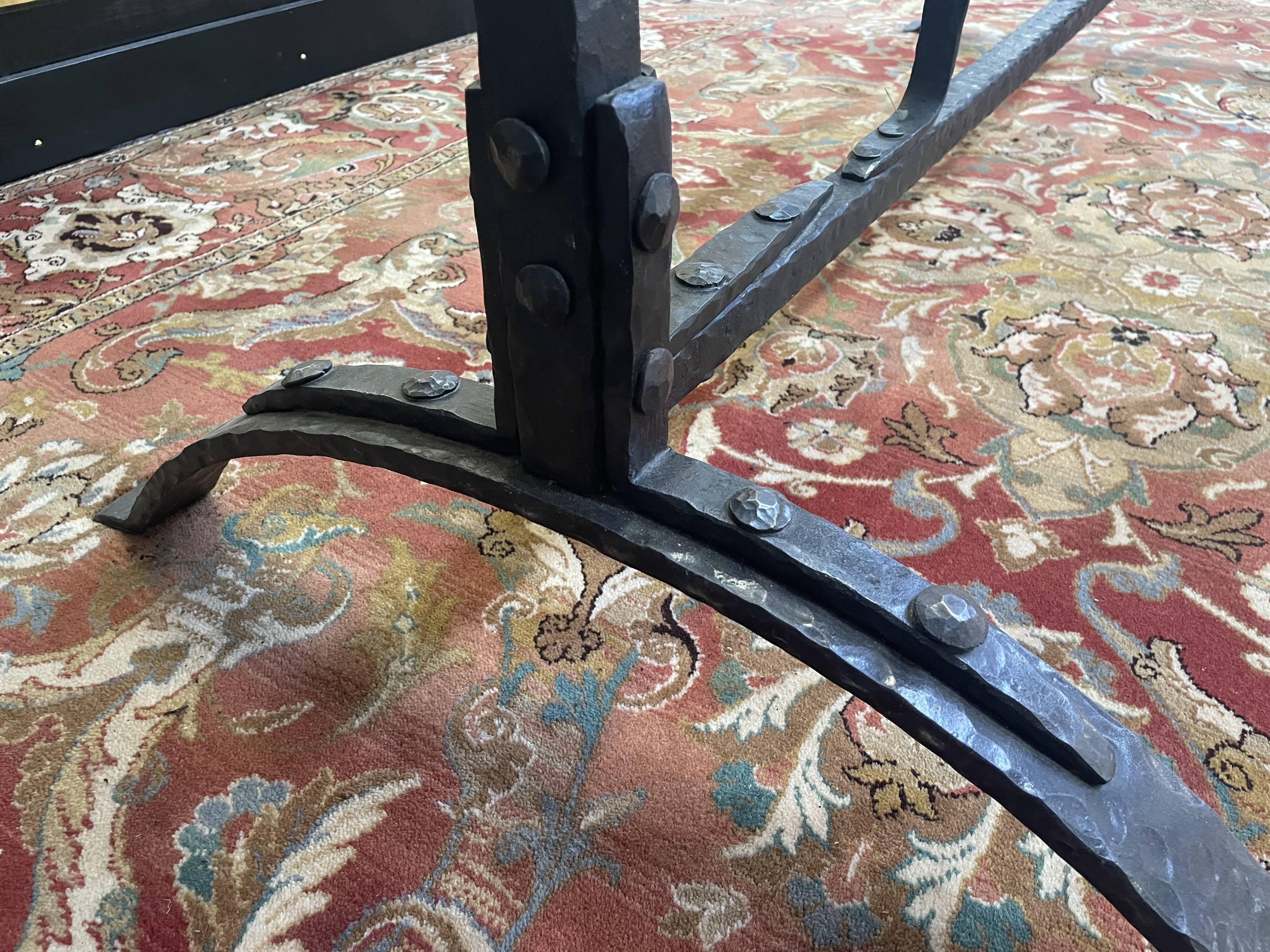 Dining table in wrought iron and glass