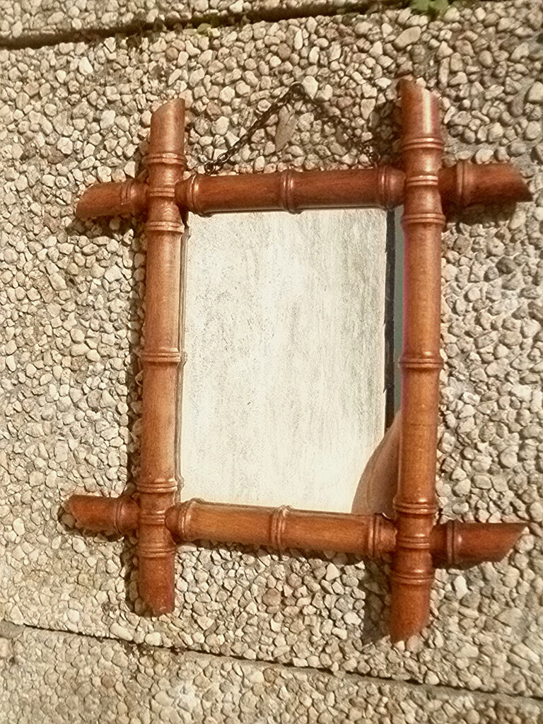 Old wooden mirror, carved bamboo way