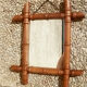 Old wooden mirror, carved bamboo way