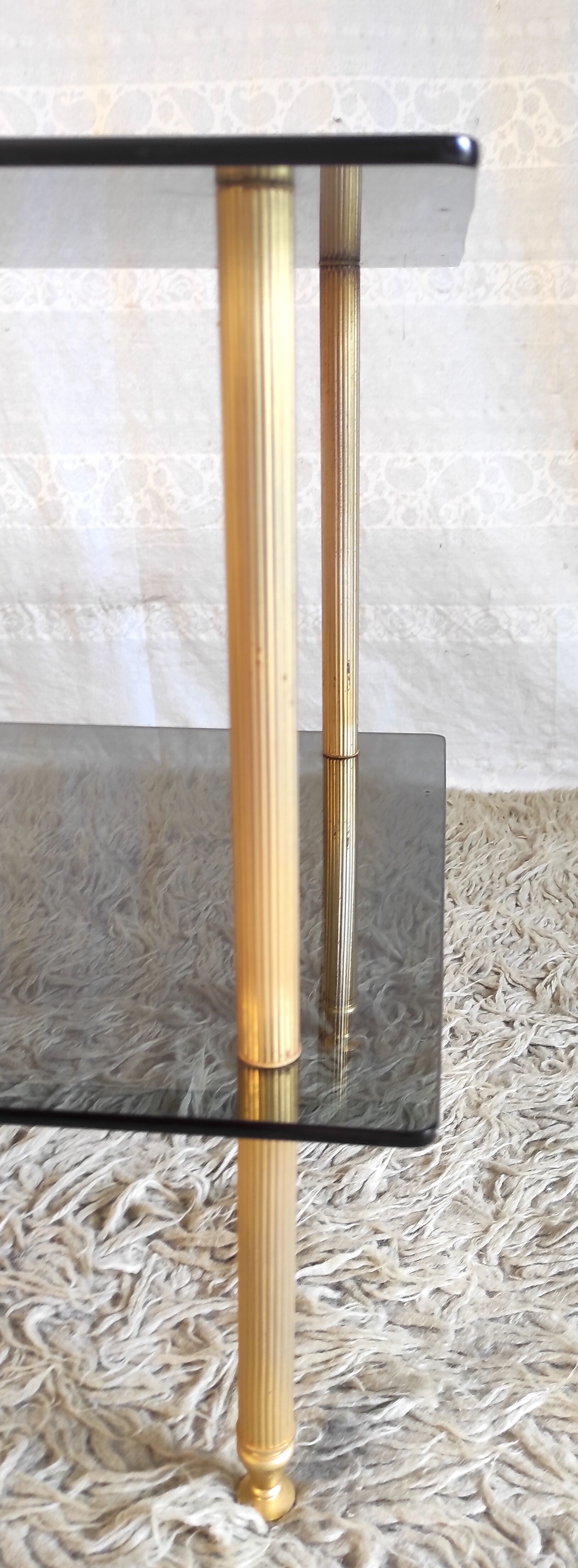 Coffee table in gilded metal and smoked glass – 60s