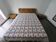 Double bed (160) in bamboo with its two bedside tables.