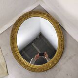 Golden oval mirror