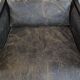 Armchair in black cowhide leather and wood with an Art Deco design