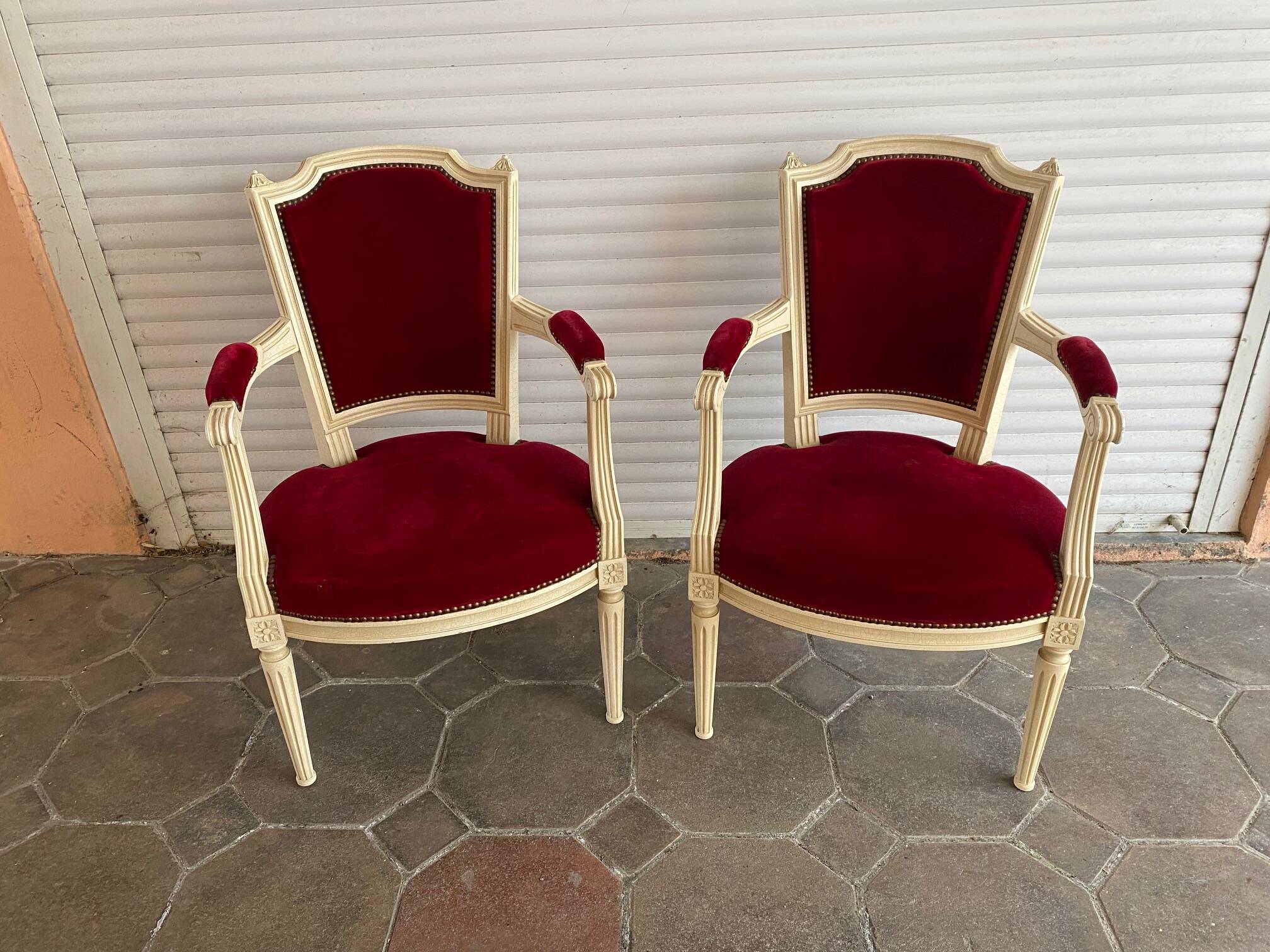 PAIR OF LOUIS XVI STYLE CABRIOLET ARMCHAIRS IN STUDDED RED VELVET FABRIC