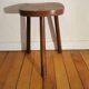 Old wooden tripod bench stool milking shepherd’s bench
