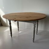 Round wooden table with flaps