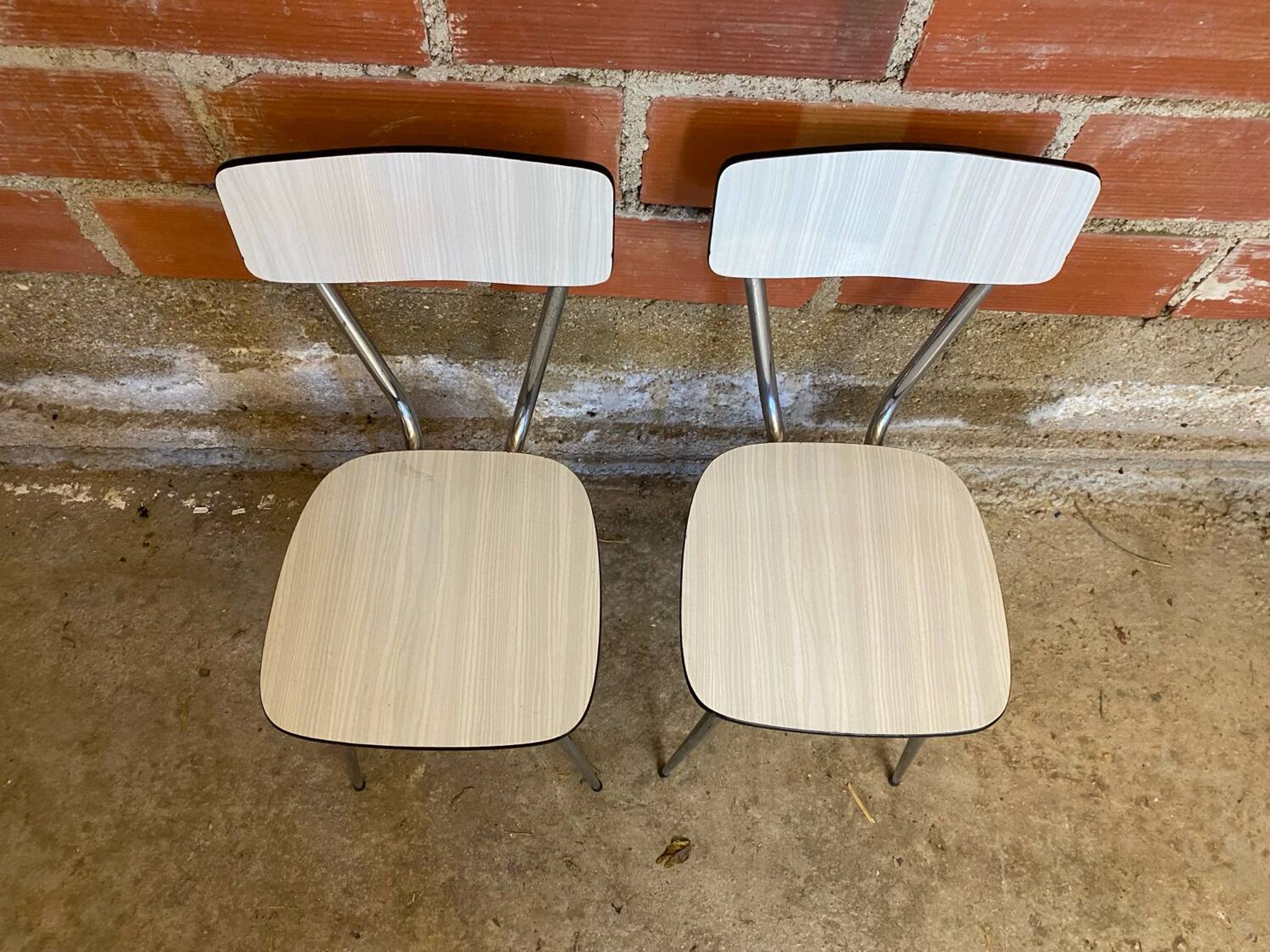 Pair of antique chrome metal chairs + white formica seat & back