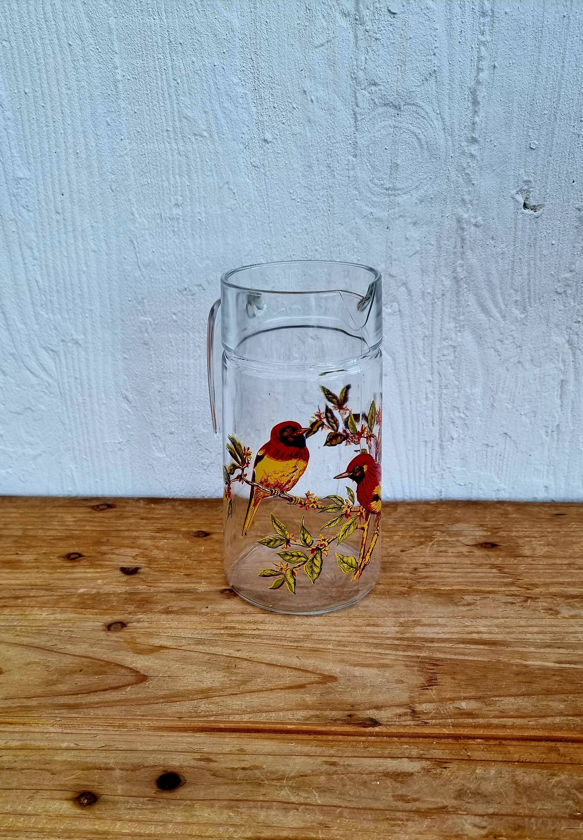 Vintage 1970s orangeade set with a jug and 8 glasses decorated with birds.