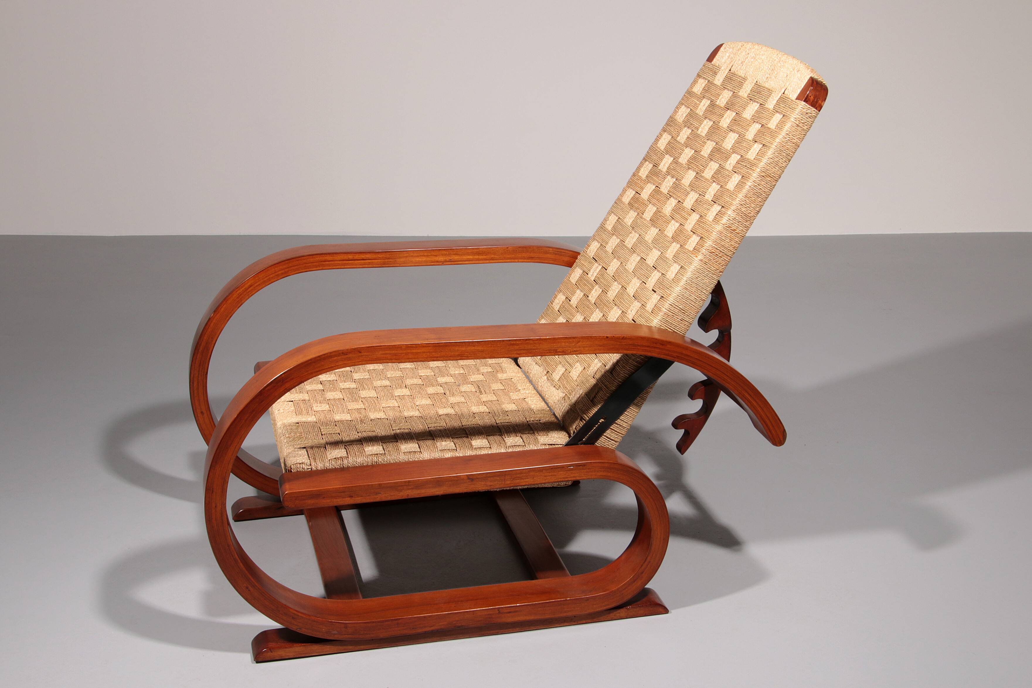 An exceptionally rare mahogany recliner crafted in Italy during the 1950s"