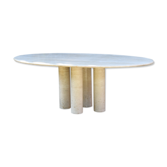 Mario Bellini's large oval dining room table in colonnata 2 travertine from the 70s
