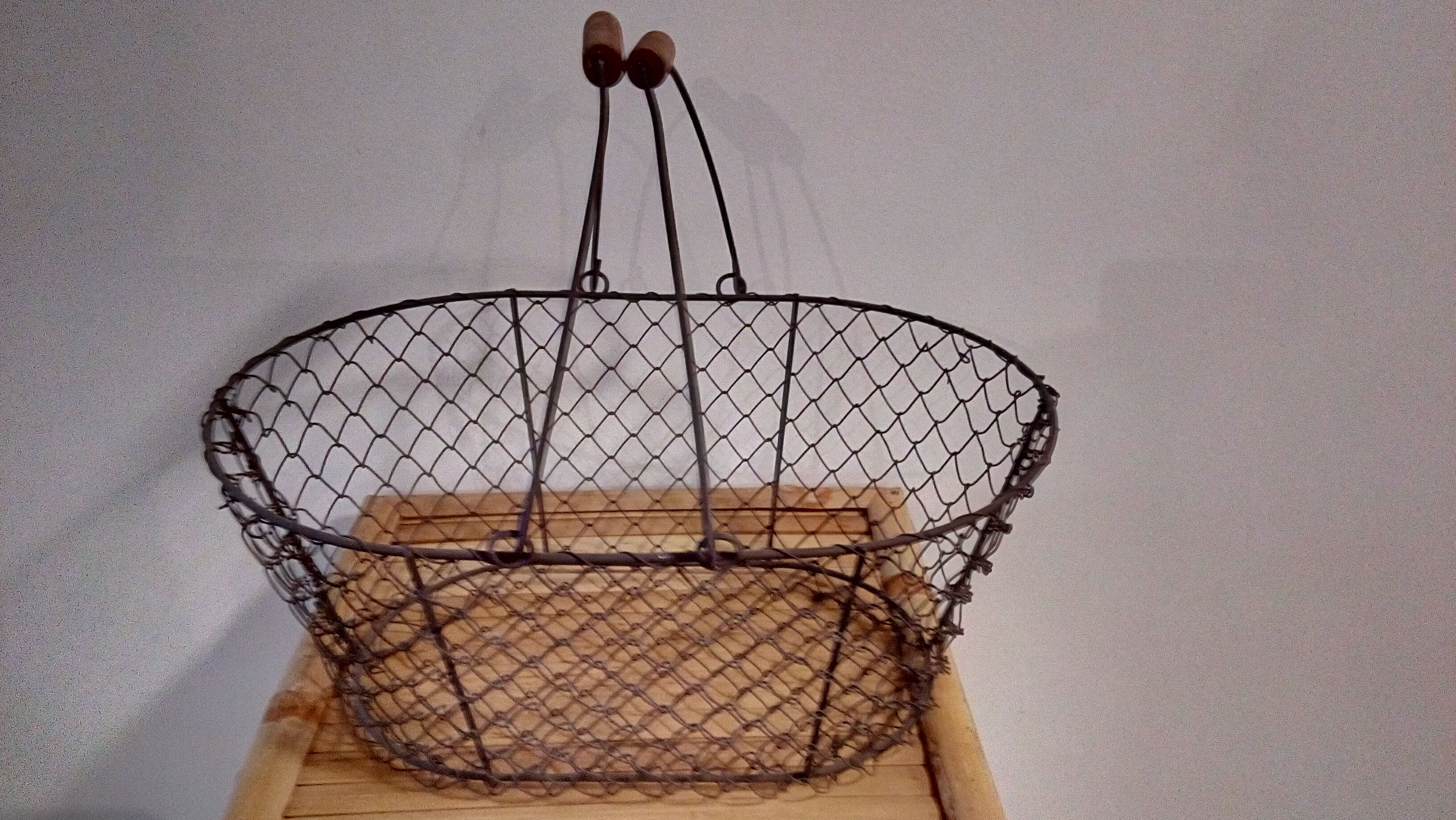 Duo of aged metal mesh baskets