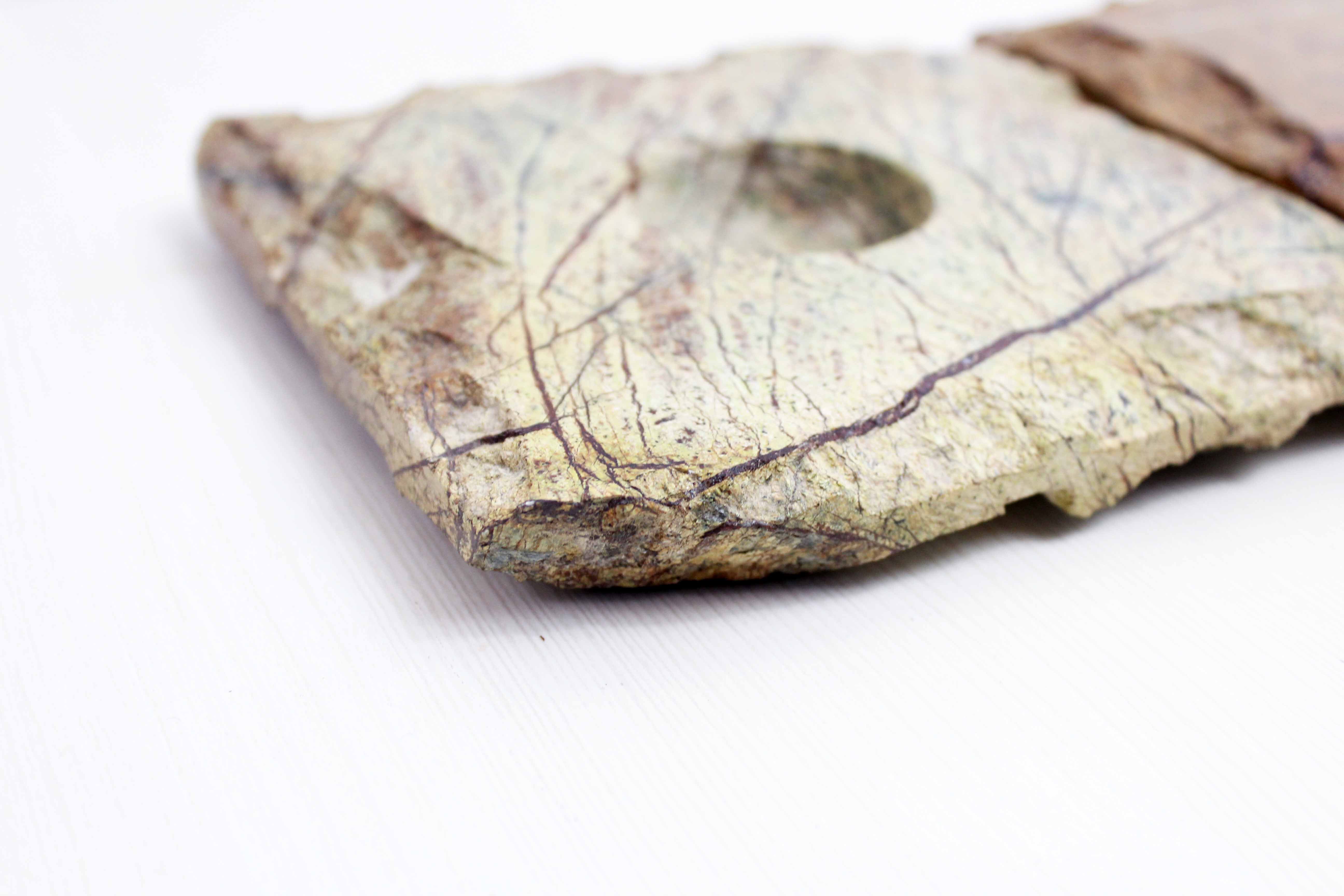 Pair of brutalist travertine candle holders