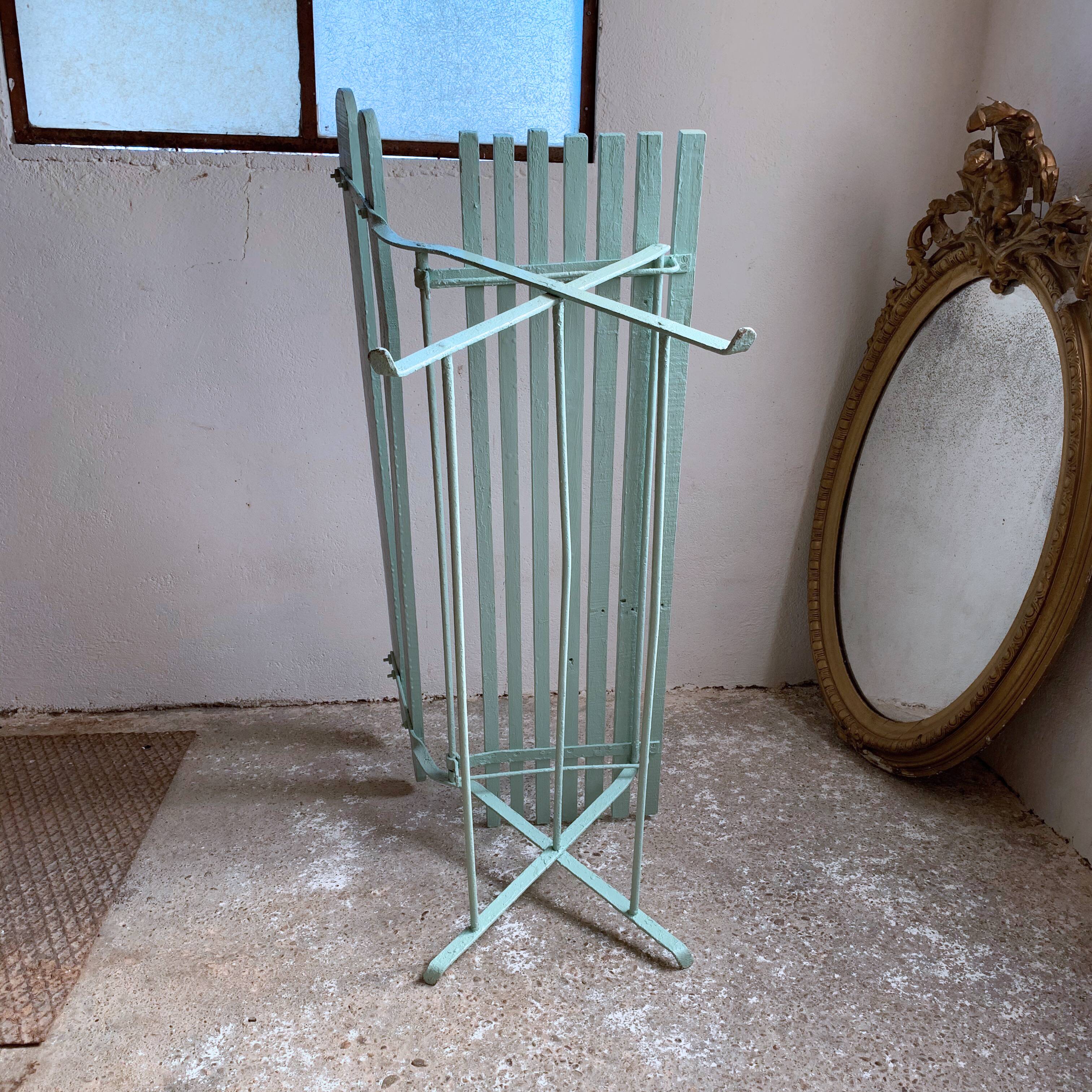 Former folding garden bench with wooden and metal slats