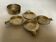 Four individual brass ashtrays